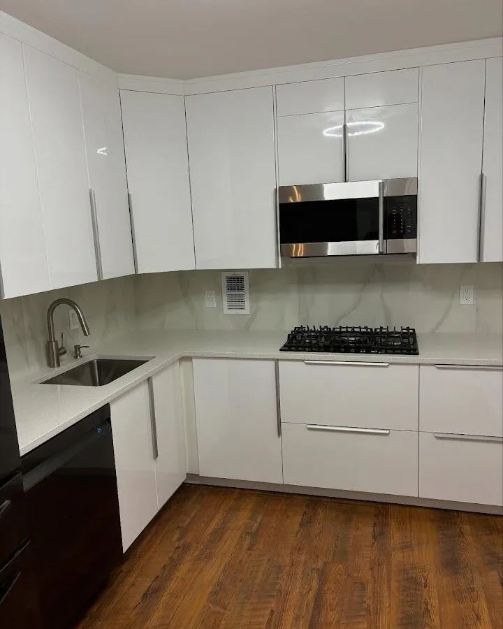 Restored kitchen with white cabinets after water damage in Lauderhill